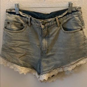 Free people jean shorts with lace trim